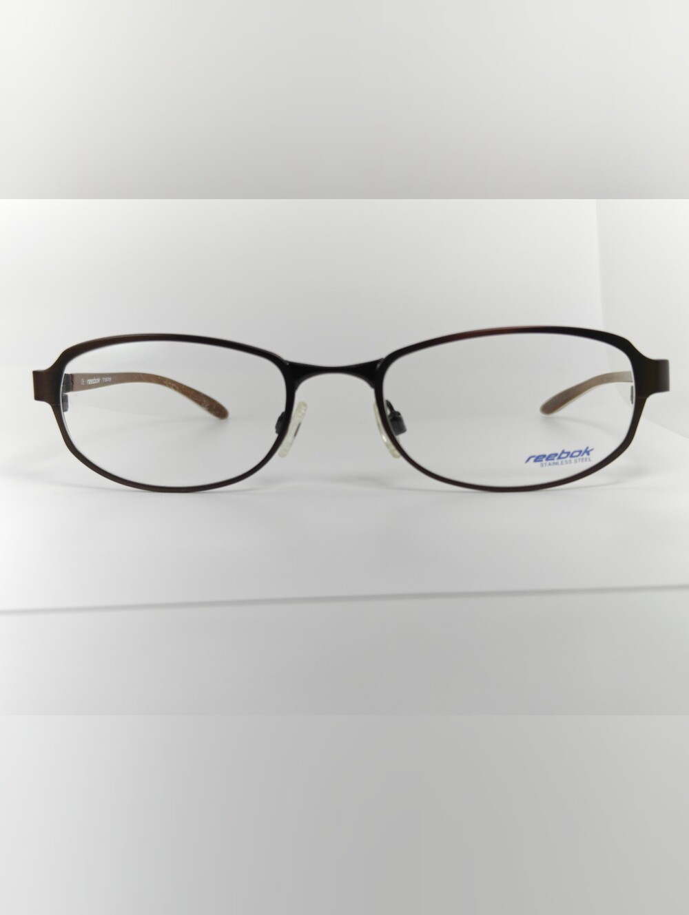 Reebok. B7012 Youth Brown Oval Optical Frames.